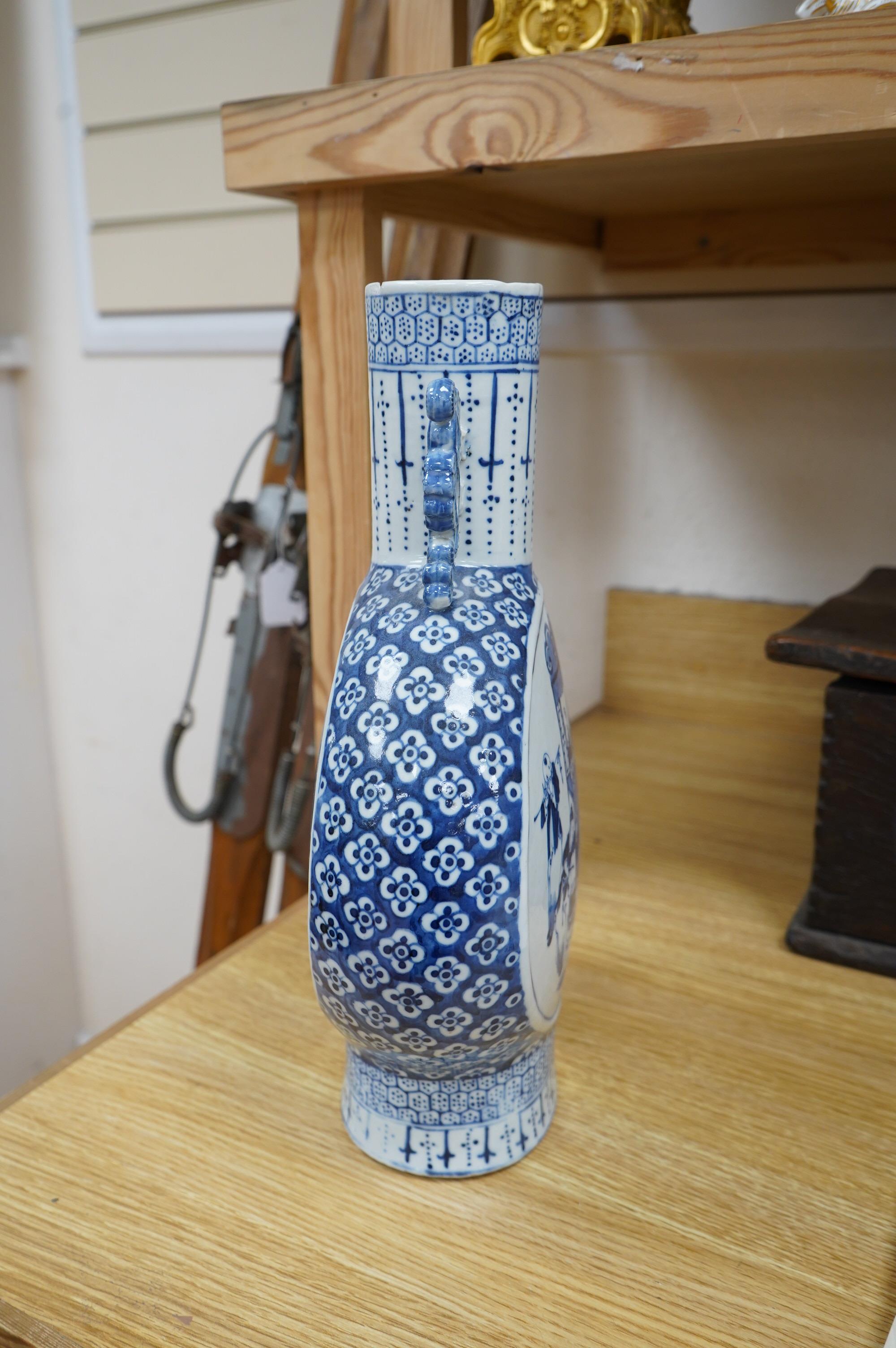 A Chinese blue and white moon flask, 36.5cm high. Condition fair, chips and hairline crack to the rim